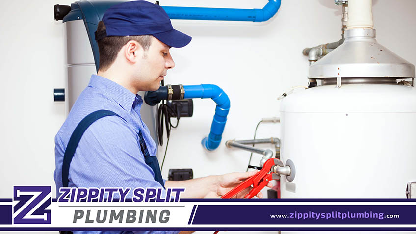 Plumber Repairing a Hot-Water Heater