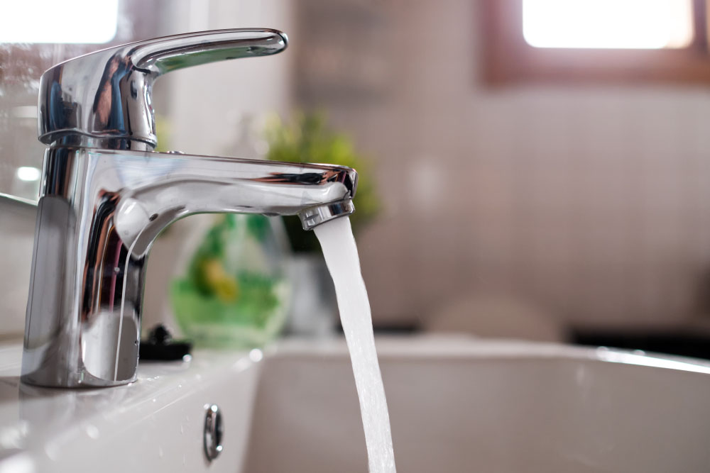 clogged sink with dirty water