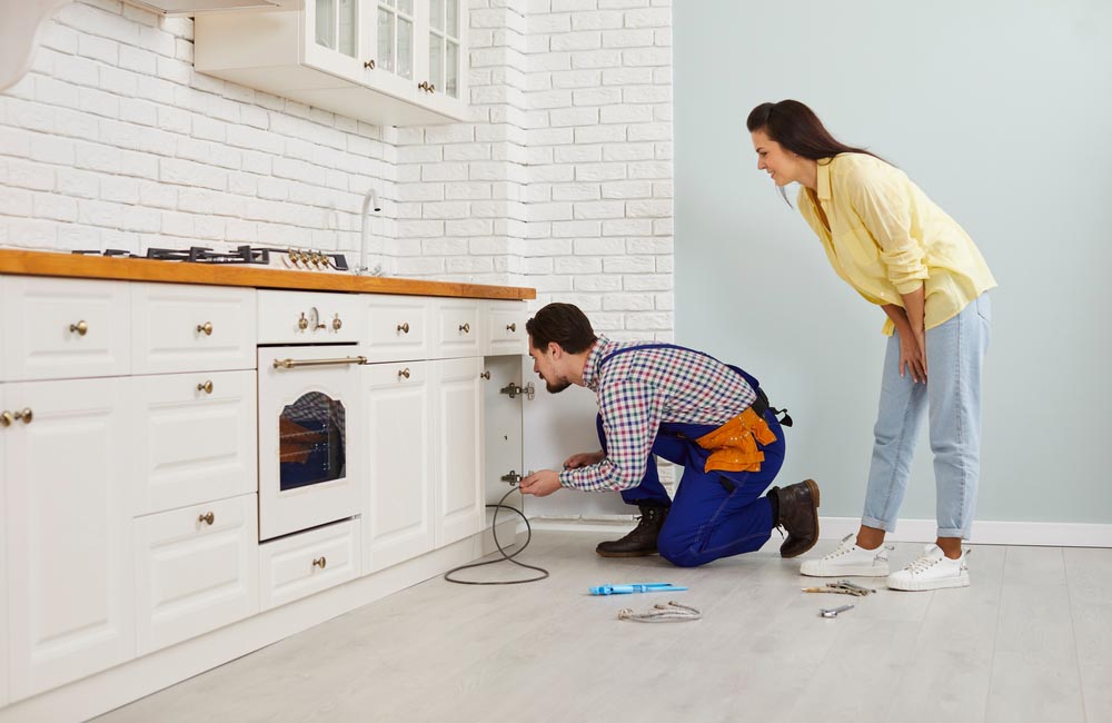 plumber snaking a drain
