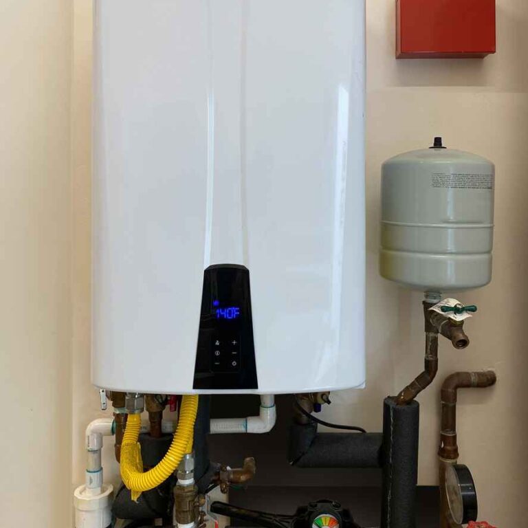 Tankless hot water heater mounted on wall of home